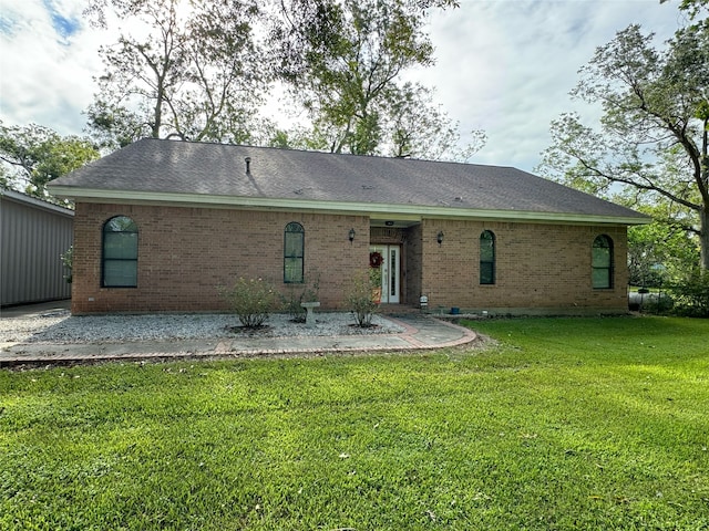 back of property featuring a lawn and a patio