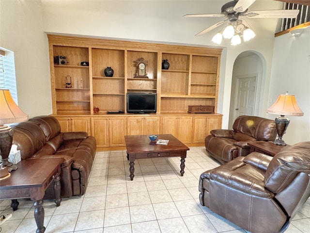 tiled living room featuring ceiling fan