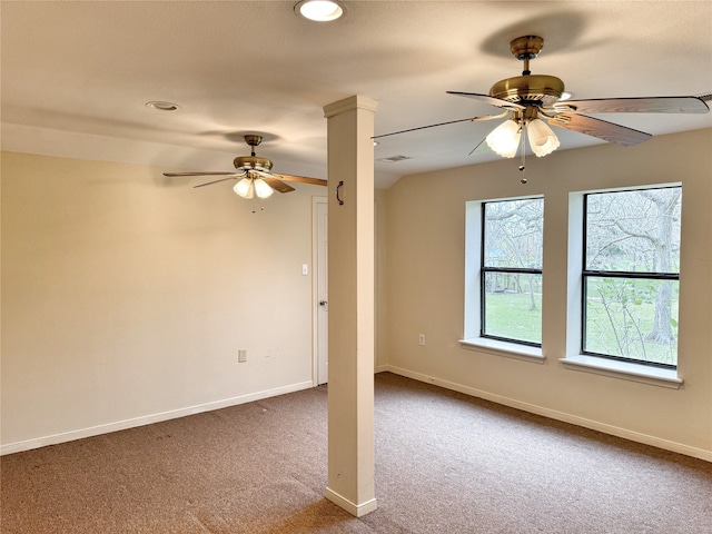 spare room with ceiling fan and carpet flooring