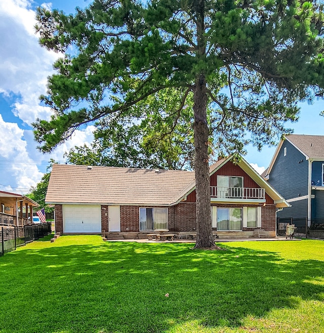 back of property with a balcony and a lawn