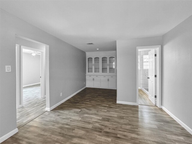 unfurnished living room featuring dark hardwood / wood-style floors