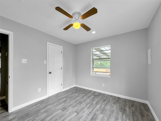 empty room featuring wood-type flooring and ceiling fan