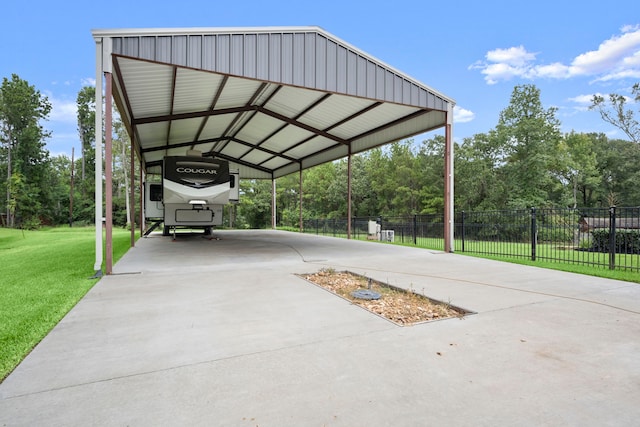 view of parking featuring a lawn and a carport