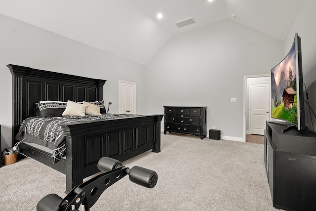 carpeted bedroom with lofted ceiling