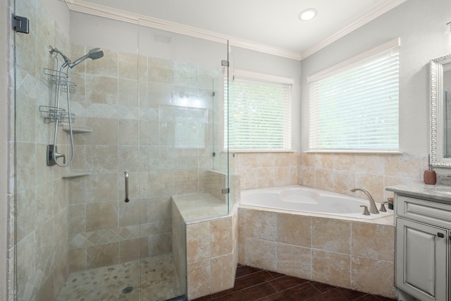 bathroom featuring independent shower and bath, vanity, crown molding, and hardwood / wood-style flooring