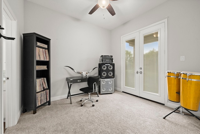 carpeted office space with french doors and ceiling fan