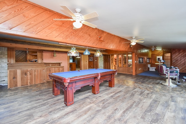 game room with billiards, wood-type flooring, ceiling fan, and wooden walls