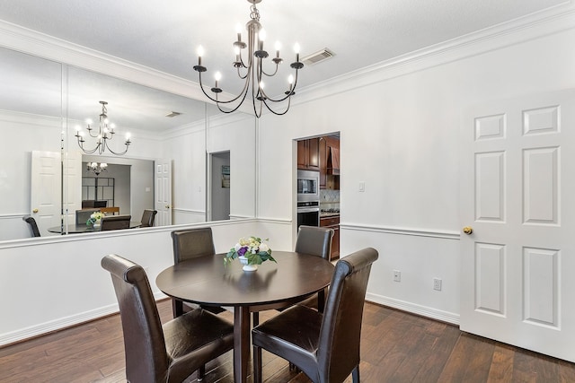 dining space with an inviting chandelier, ornamental molding, and dark wood-type flooring