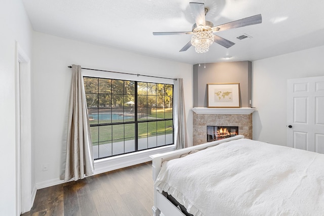 bedroom with dark wood-type flooring and ceiling fan