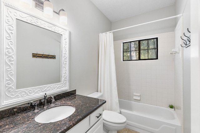 full bathroom featuring vanity, toilet, shower / tub combo, and a textured ceiling