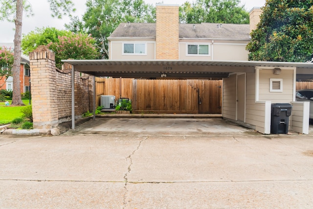 exterior space featuring a carport and central air condition unit