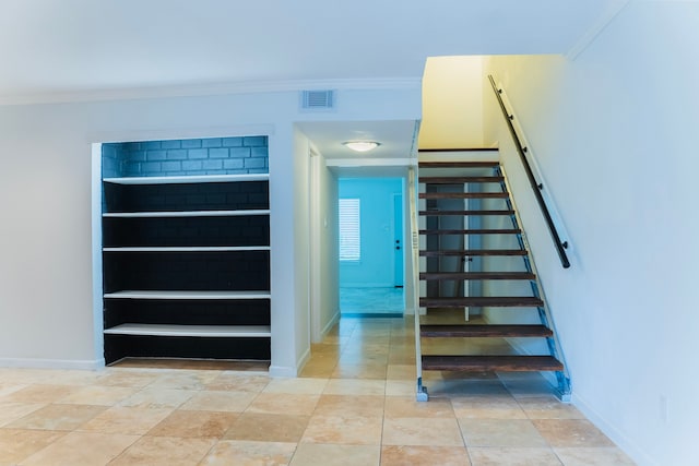 staircase with crown molding