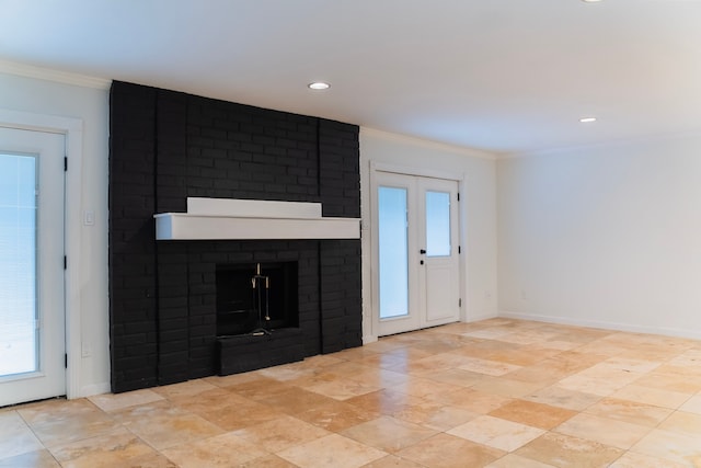 unfurnished living room with crown molding and a brick fireplace