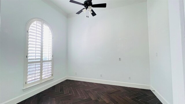 unfurnished room with ceiling fan, ornamental molding, and dark parquet floors