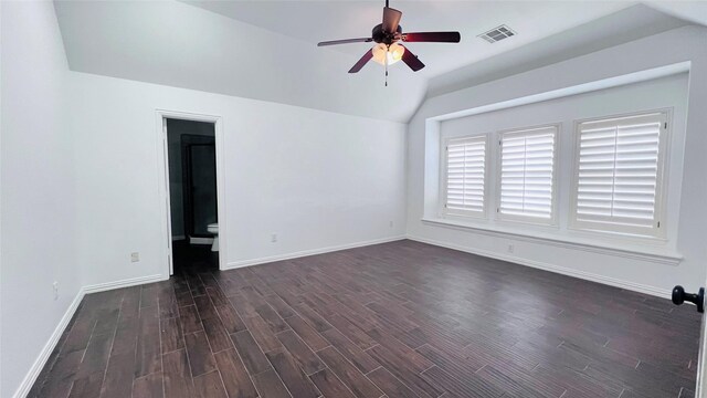 empty room featuring lofted ceiling, ceiling fan, and dark hardwood / wood-style floors