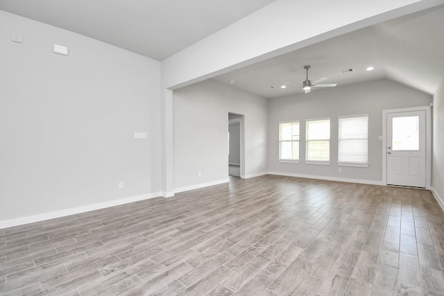 19722 Vino Vale Dr, Hockley, TX 77447 - unfurnished living room featuring light wood-style floors, a ceiling fan, lofted ceiling, recessed lighting, and baseboards