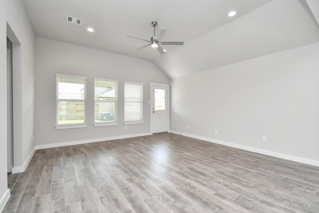 19722 Vino Vale Dr, Hockley, TX 77447 - unfurnished living room featuring ceiling fan, wood finished floors, vaulted ceiling, baseboards, and recessed lighting