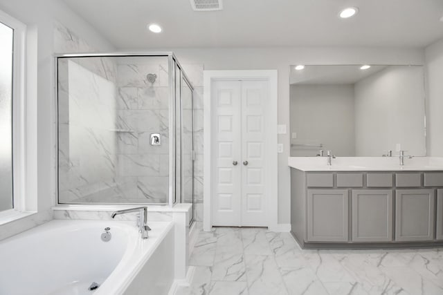 19722 Vino Vale Dr, Hockley, TX 77447 - bathroom featuring a garden tub, marble finish flooring, a marble finish shower, recessed lighting, and double vanity