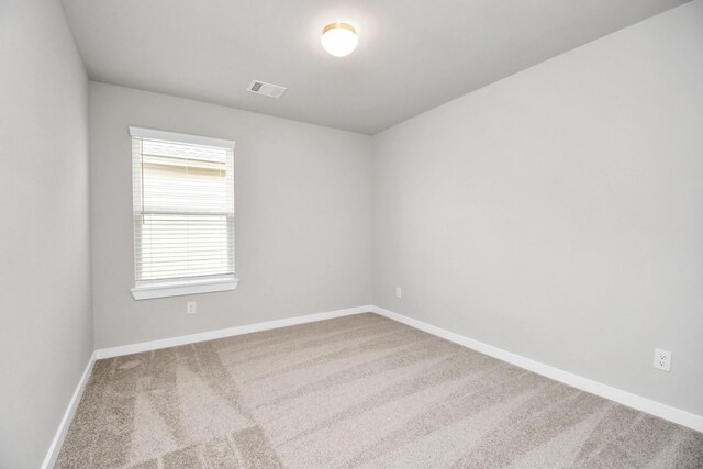 unfurnished room featuring carpet flooring