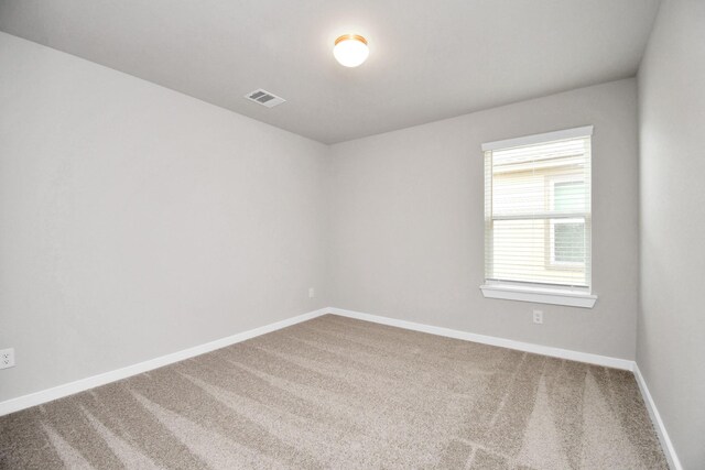 empty room featuring carpet flooring