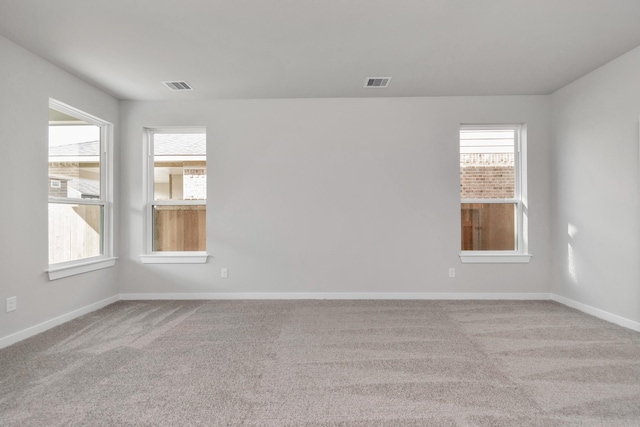 8447 Northern Pintail Dr, Houston, TX 77049 - empty room with carpet, healthy amount of natural light, and baseboards