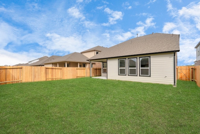 8447 Northern Pintail Dr, Houston, TX 77049 - rear view of property with a shingled roof