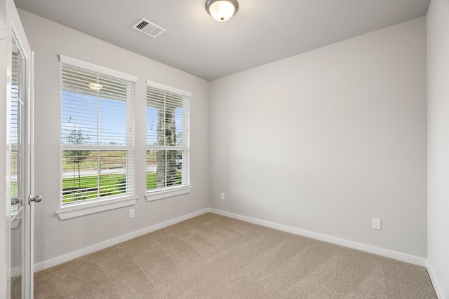 empty room with carpet flooring