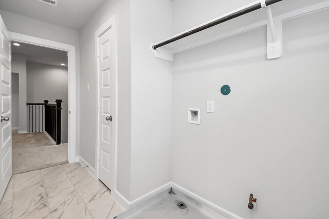 washroom with washer hookup, light colored carpet, and hookup for a gas dryer