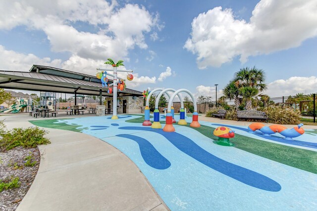 view of community featuring a playground and a gazebo