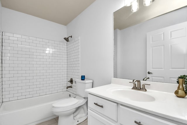 full bathroom with tiled shower / bath, vanity, and toilet