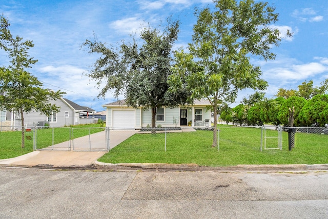 view of front of home featuring a garage and a front yard