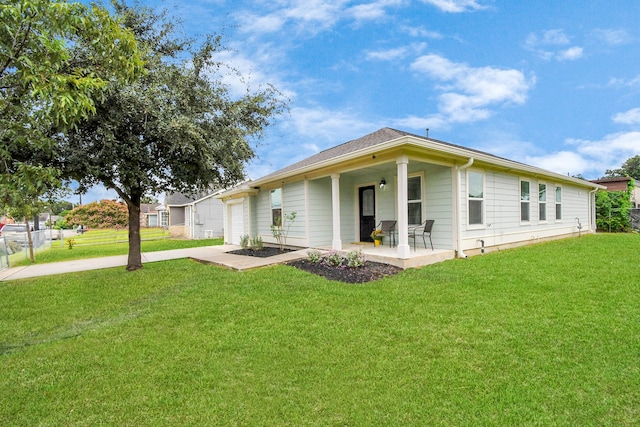 rear view of property featuring a lawn