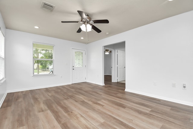 unfurnished room with wood-type flooring and ceiling fan