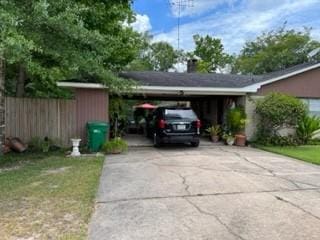 1702-1704 Southline St Unit 170, Cleveland, TX 77327 - view of car parking featuring driveway and an attached carport