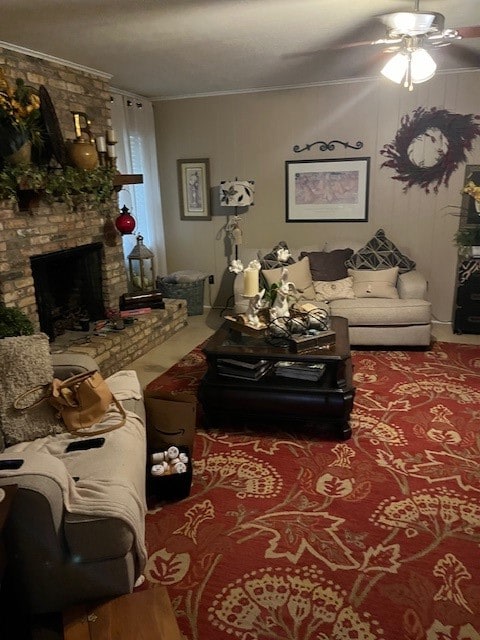 living room with a fireplace, ornamental molding, and ceiling fan