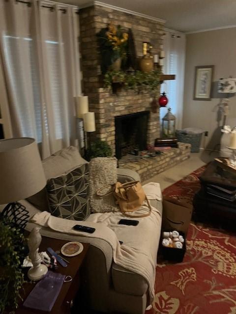 1702-1704 Southline St Unit 170, Cleveland, TX 77327 - living area with crown molding and a fireplace
