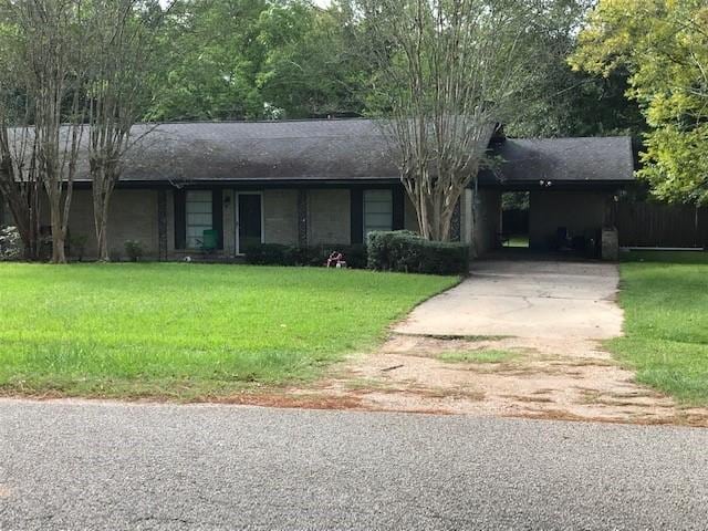 1702-1704 Southline St Unit 170, Cleveland, TX 77327 - ranch-style house with concrete driveway, a front lawn, and a carport