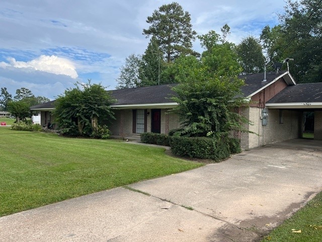 single story home with a carport and a front yard