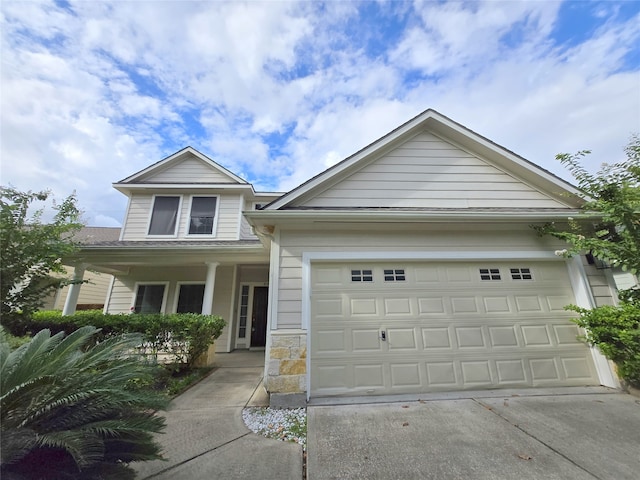 view of front of home featuring a garage and a porch