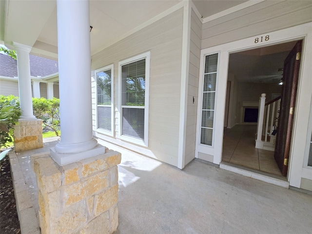 entrance to property featuring covered porch