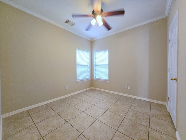 unfurnished room featuring ornamental molding, ceiling fan, and light tile patterned floors