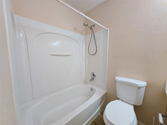 bathroom featuring toilet and bathtub / shower combination