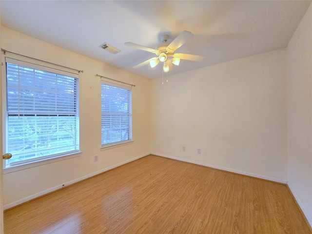 unfurnished room with light hardwood / wood-style floors and ceiling fan