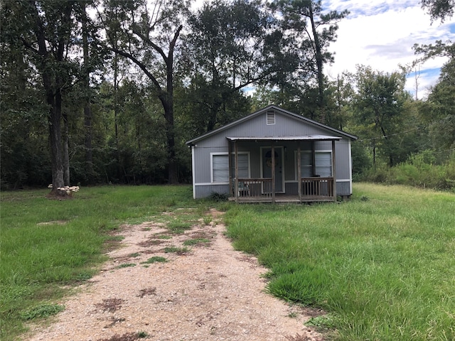 view of outdoor structure with covered porch