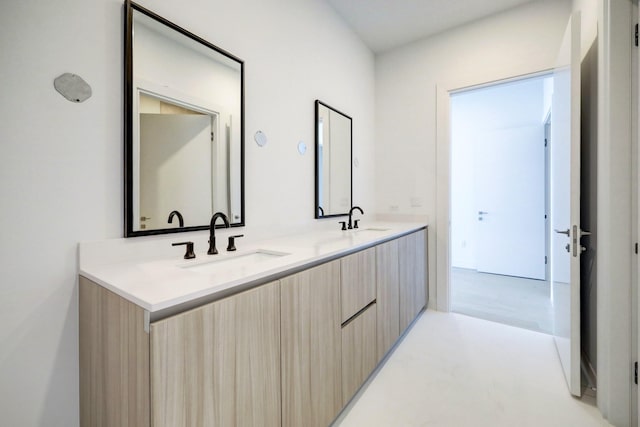 bathroom with vanity and concrete floors