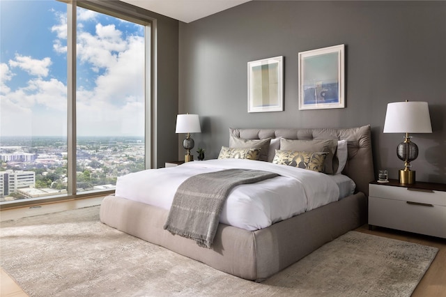 bedroom featuring floor to ceiling windows