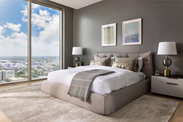 bedroom featuring a wall of windows