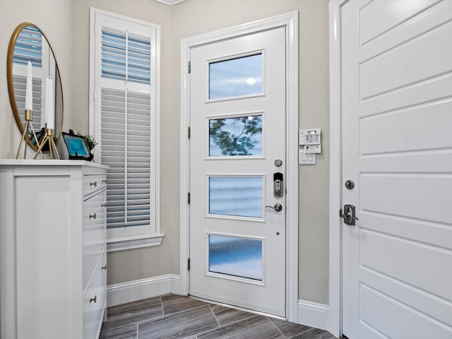 entryway with dark hardwood / wood-style floors