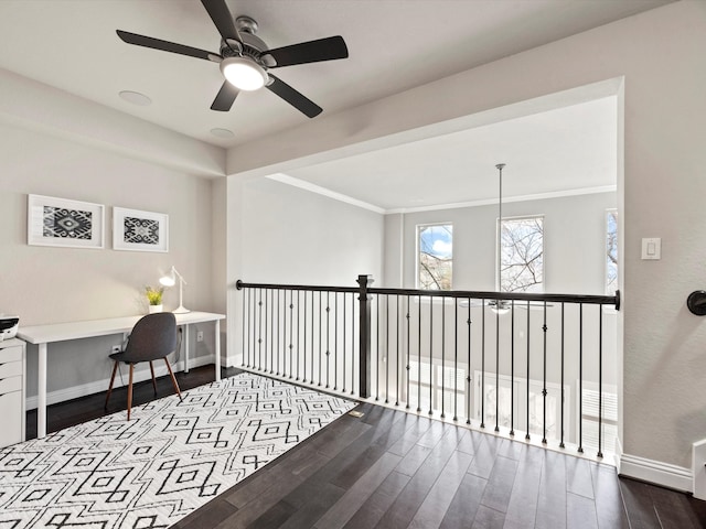 home office with ornamental molding, ceiling fan, and hardwood / wood-style floors