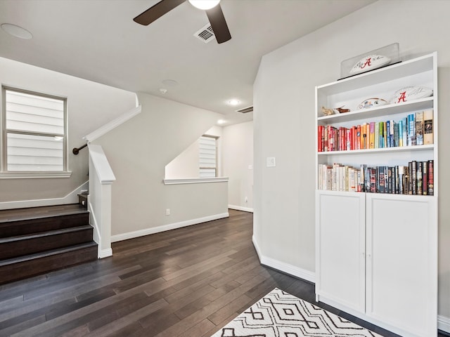 interior space featuring dark hardwood / wood-style flooring and ceiling fan